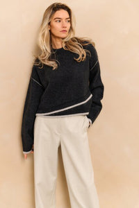Knitted sweater with contrasting lines