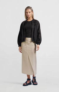 A women's lightweight bomber jacket in a soft beige color with a relaxed, slightly oversized fit. It features a round neckline, a full-length front zipper, and gathered detailing along the chest for a subtle textured effect. The long sleeves are voluminous and taper into elasticated cuffs, while the hem also has an elastic finish for a comfortable and slightly cropped silhouette.